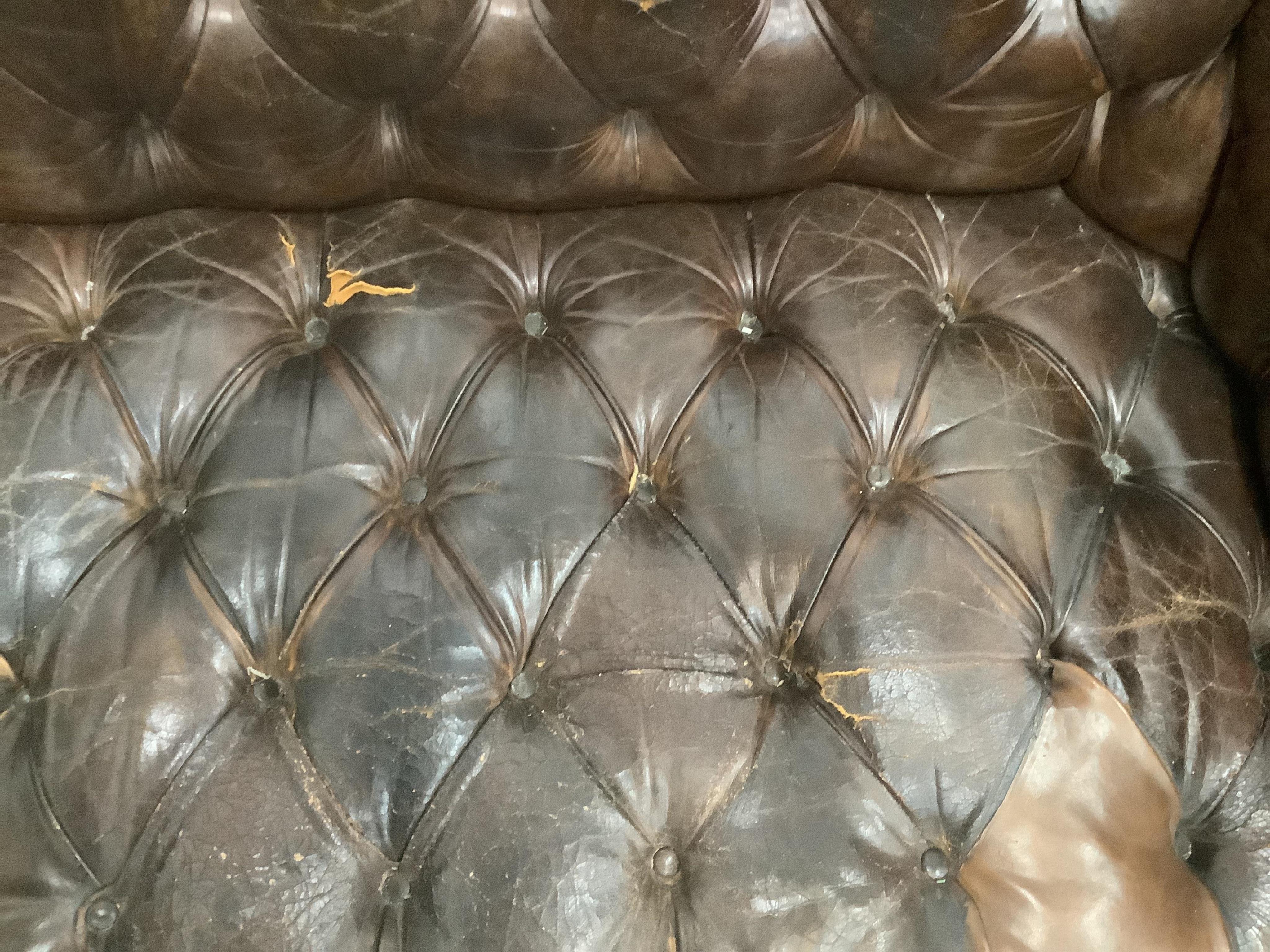 An early 20th century buttoned brown leather Chesterfield sofa, width 200cm, depth 90cm, height 72cm. Condition - fair, some patching and minor tears